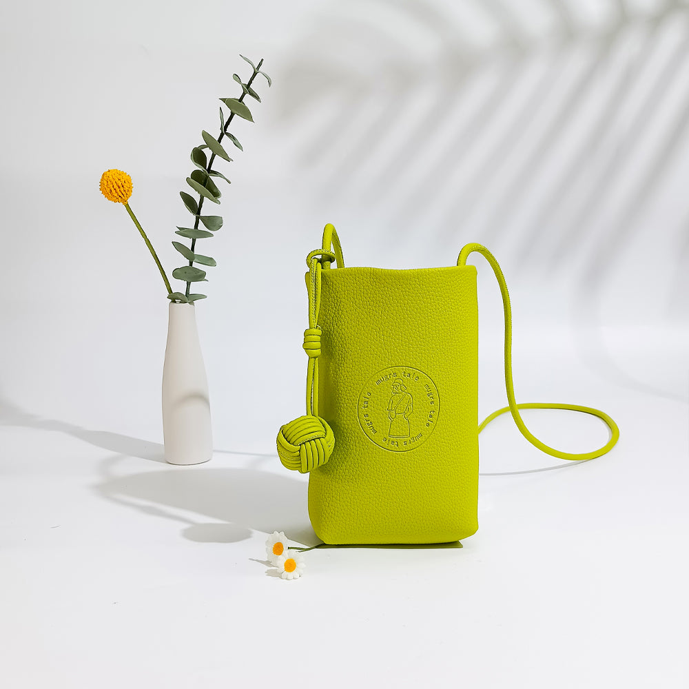Mini crossbody bag styled as everyday fashion accessory by Mugrs