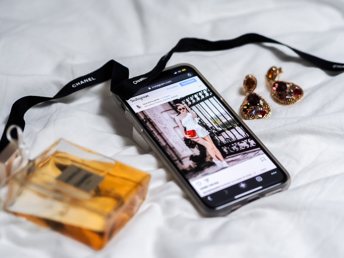 black android smartphone on white textile