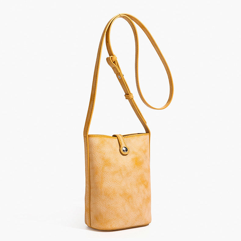 MUGRS women's small crossbody bag in Orange – front view, waxed vegetable-tanned leather