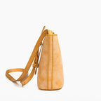 MUGRS women's crossbody phone bag in Orange – side profile, slim compact silhouette