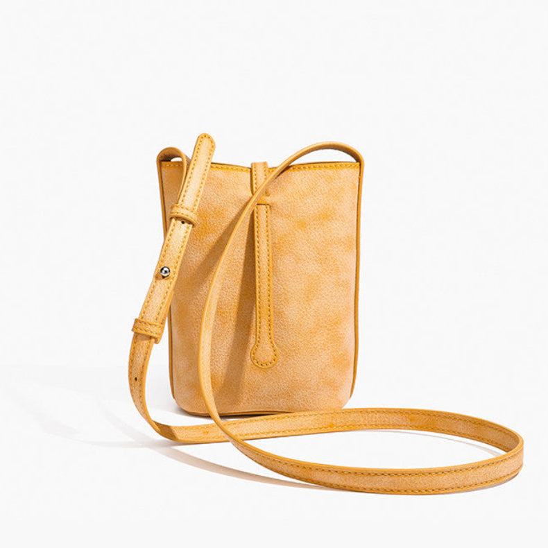 MUGRS women's leather crossbody bag in Orange – three-quarter angle, casual everyday bag