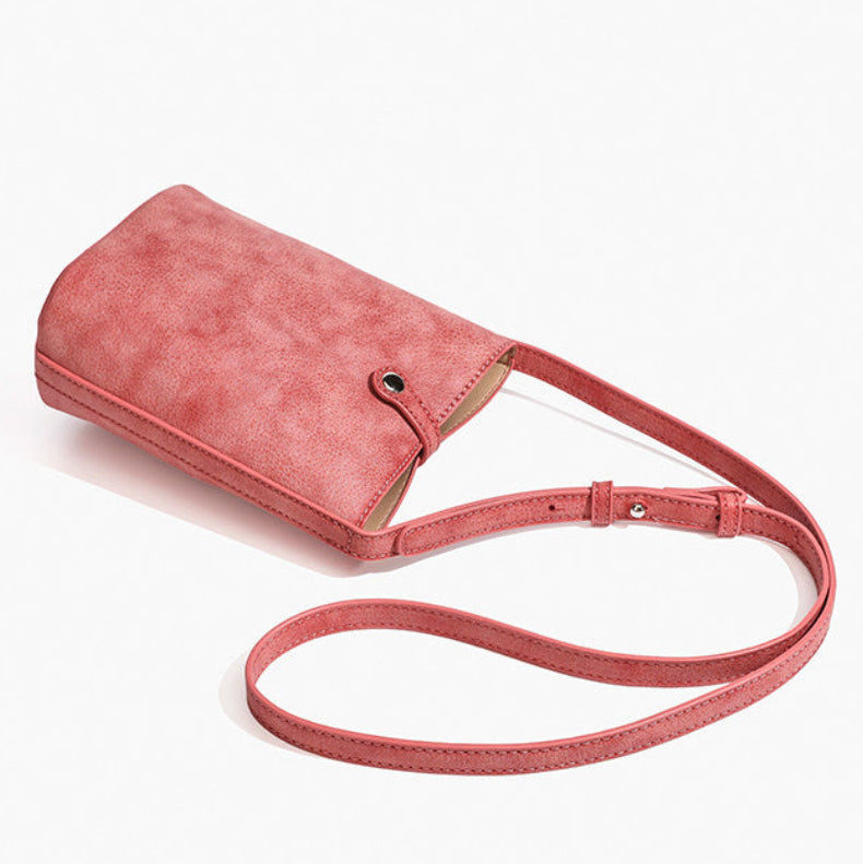 MUGRS women's small crossbody bag in Watermelon Red – front view with strap, muted red leather
