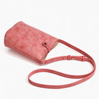 MUGRS women's small crossbody bag in Watermelon Red – front view with strap, muted red leather
