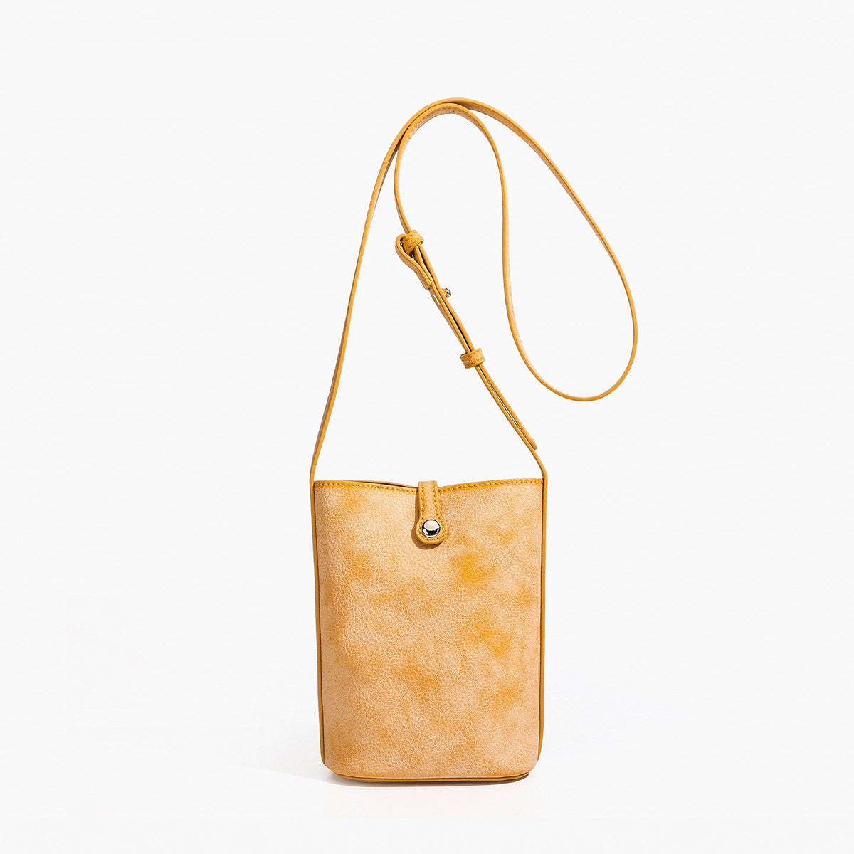 MUGRS women's leather crossbody bag in Orange – front view, lightweight everyday carry