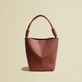 MUGRS compact women's bucket bag in Brick Red