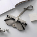 MUGRS women's eyeglass case in Grey – top-down flat lay, for travel