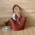MUGRS women's bucket bag in Red – close-up of hardware and clasp, compact, casual day bag