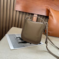 MUGRS women's phone bag in Khaki – interior compartment open, simple, hands-free