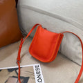 MUGRS women's phone bag in Orange – styled with casual outfit, mini, hands-free