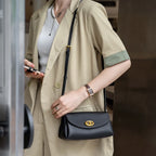 Mini sac à bandoulière en cuir simple avec bouton Mugrs™