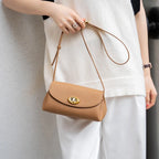 Mini sac à bandoulière en cuir simple avec bouton Mugrs™