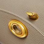 Mini sac à bandoulière en cuir simple avec bouton Mugrs™