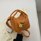 Mugrs™ Handtasche aus Rindsleder mit goldener Schnalle und Kissen im Luxusdesign
