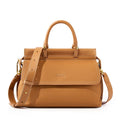 MUGRS women's crossbody bag in Brown – close-up of hardware and clasp, medium, hands-free