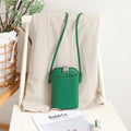 MUGRS women's phone bag in Grass Green – close-up of the flap, compact, hands-free