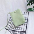 MUGRS vegan leather compact women's crossbody bag in Pastel Sage