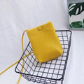 MUGRS women's crossbody bag in Pastel Yellow – back view, compact, hands-free